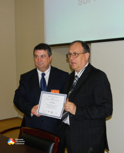 6. Professors Theodor Valentin Purcarea and Virgil Popa when handingreceiving Diploma of Special Merit.3